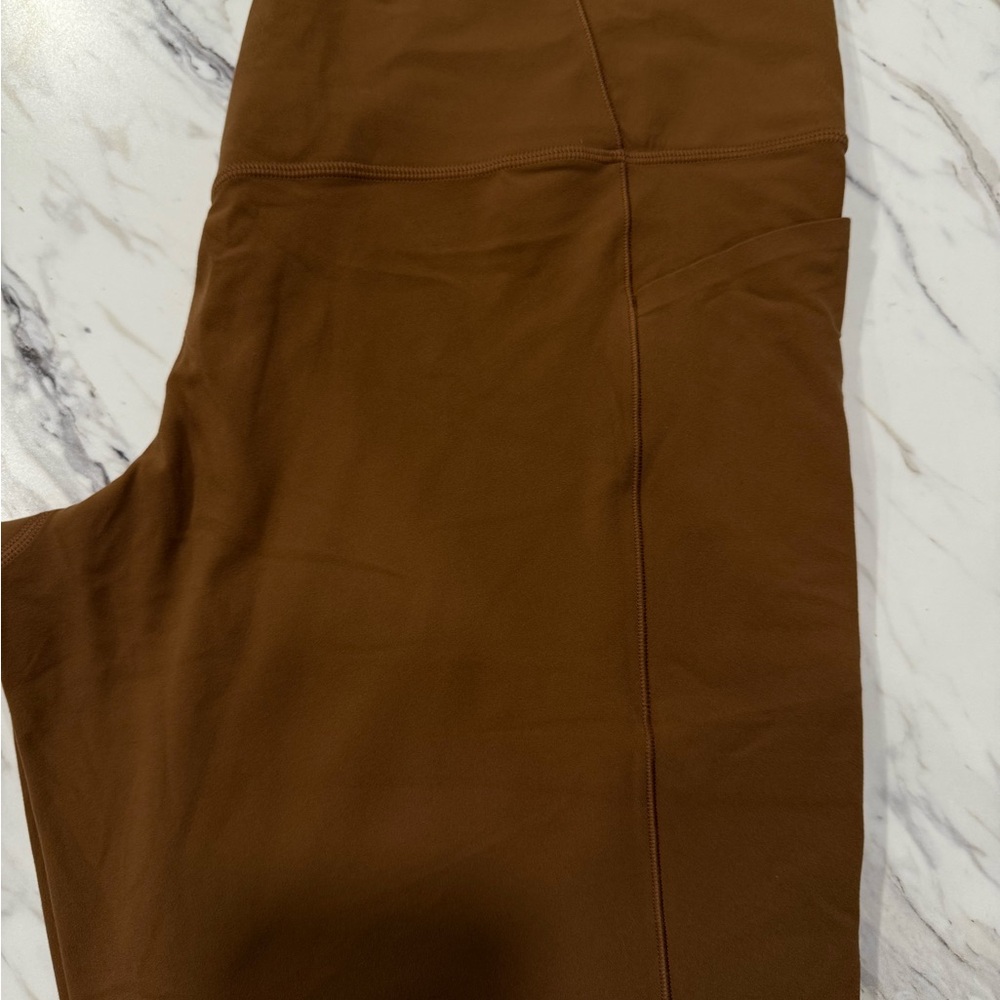 Athleta Caramel Salutation Stash Tights